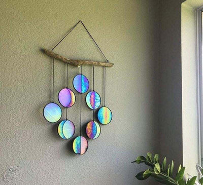 Rainbow hanging art moon phase wall decoration made of iron, featuring colorful circular discs.