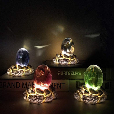 LED Lava Dragon Egg ornamental decor with glowing dinosaur eggs, made of resin, showcasing realistic dinosaur figures inside, suitable for home decoration and fantasy enthusiasts.