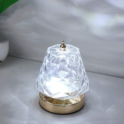 Water Ripple Dynamic Projection Lamp with crystal-like acrylic shade emits ambient light for home decor.