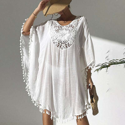 Sexy tassel trim crochet cover up with round neck and boho style for women.