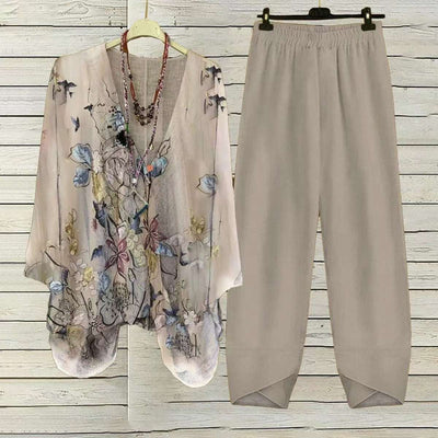 Digital printed round neck women's two-piece set in spandex fabric, featuring a floral character pattern on top and camel pants, suitable for casual wear.
