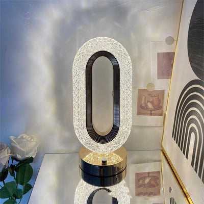 Modern minimalist O-shaped crystal desk lamp in luxury style, metal holder, decorative home decor.