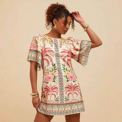 Retro crew neck dress with horn print, colorful floral design, bell sleeves, short A-line skirt.